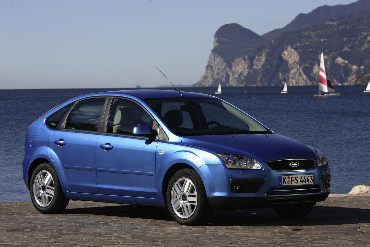 This archival image documents the 2000 Ford Focus Mark I on scenic beach with boats MS4408 and is preserved in the Ford Heritage Vault as part of Ford Motor Company's historic photographic archive. Free for personal, non-commercial use. Ford Herit...
