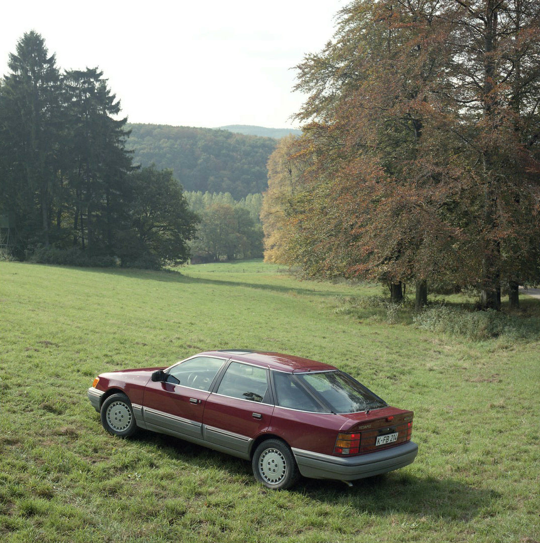 This archival image documents the 1986 Merkur Scorpio rear aerial view in field in Cologne and is preserved in the Ford Heritage Vault as part of Ford Motor Company's historic photographic archive. Free for personal, non-commercial use. Ford Herit...