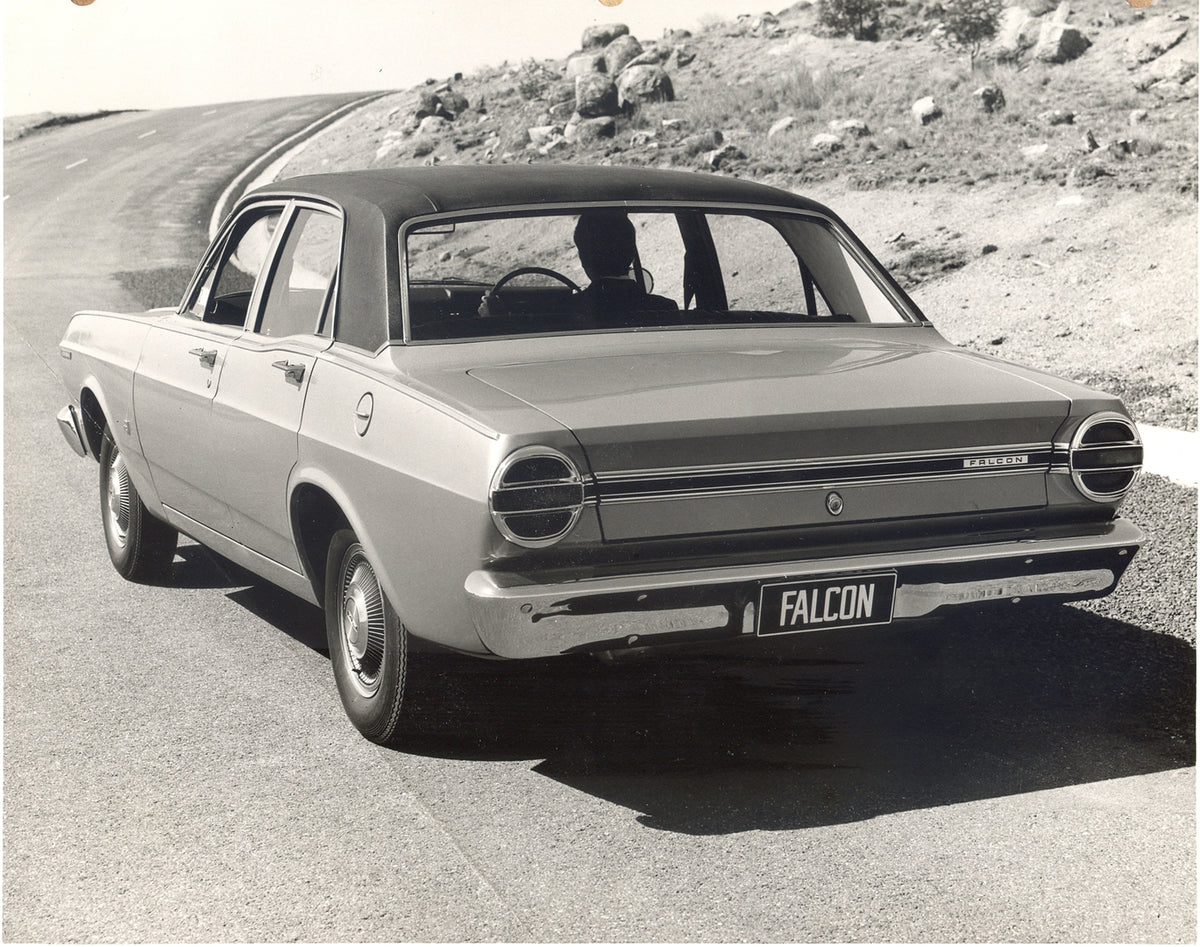 This archival image documents the 1968 Ford XT Falcon rear view on scenic road and is preserved in the Ford Heritage Vault as part of Ford Motor Company's historic photographic archive. Free for personal, non-commercial use. Ford Heritage Vault re...