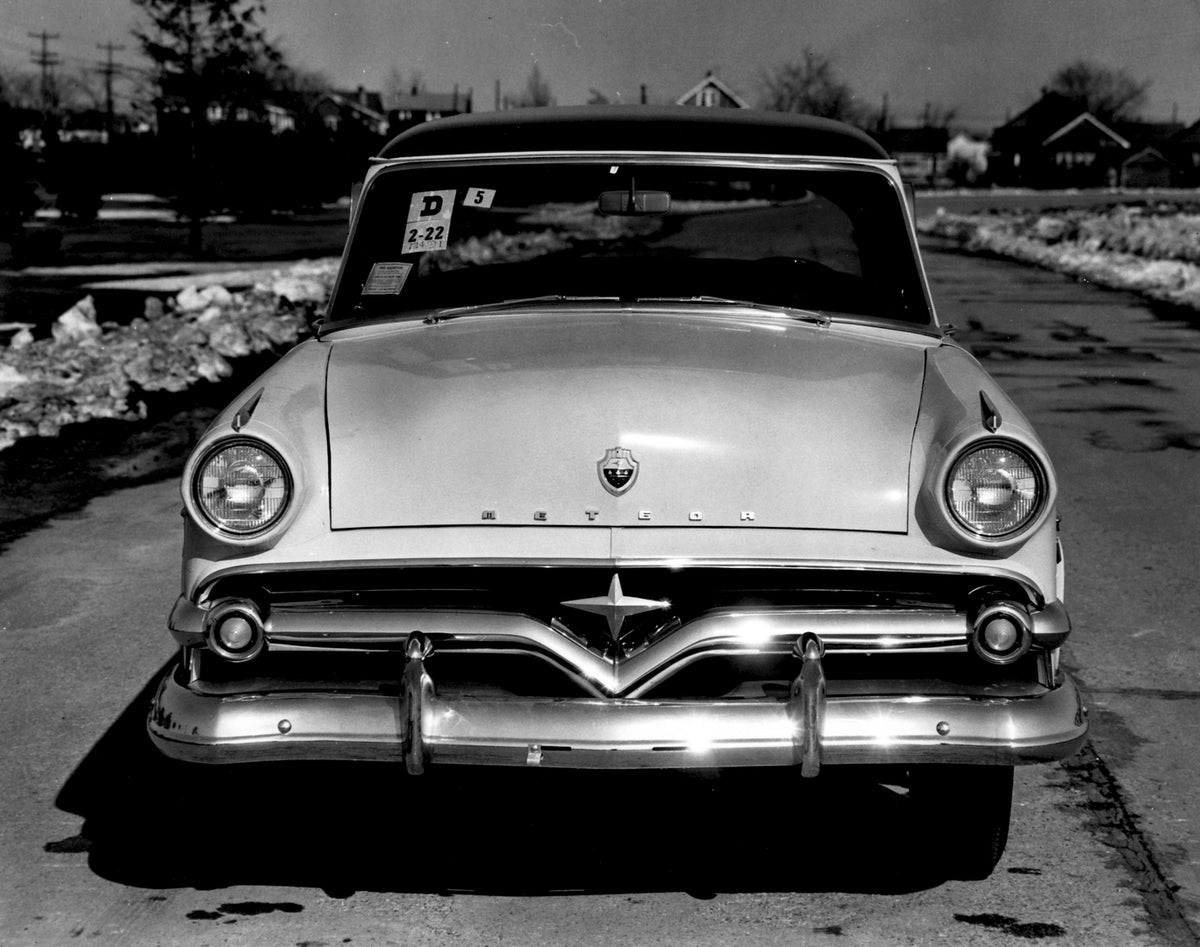 This archival image documents the 1954 Meteor Mainline Coupe front view on scenic road AR-2007-5 and is preserved in the Ford Heritage Vault as part of Ford Motor Company's historic photographic archive. Free for personal, non-commercial use. Ford...