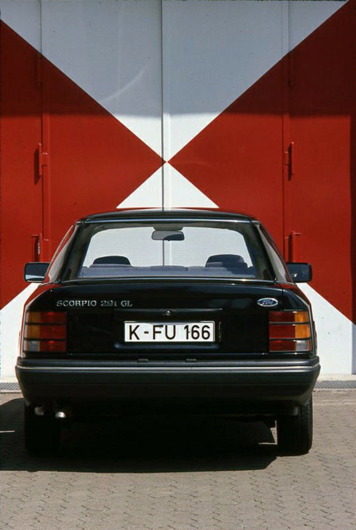 This archival image documents the 1986 Ford Scorpio Mark I 2.9i GL rear view in front of scenic wall and is preserved in the Ford Heritage Vault as part of Ford Motor Company's historic photographic archive. Free for personal, non-commercial use. ...