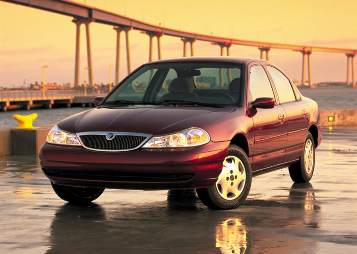 This archival image documents the 1999 Mercury Mystique with Bridge in Background and is preserved in the Ford Heritage Vault as part of Ford Motor Company's historic photographic archive. Free for personal, non-commercial use. Ford Heritage Vault...