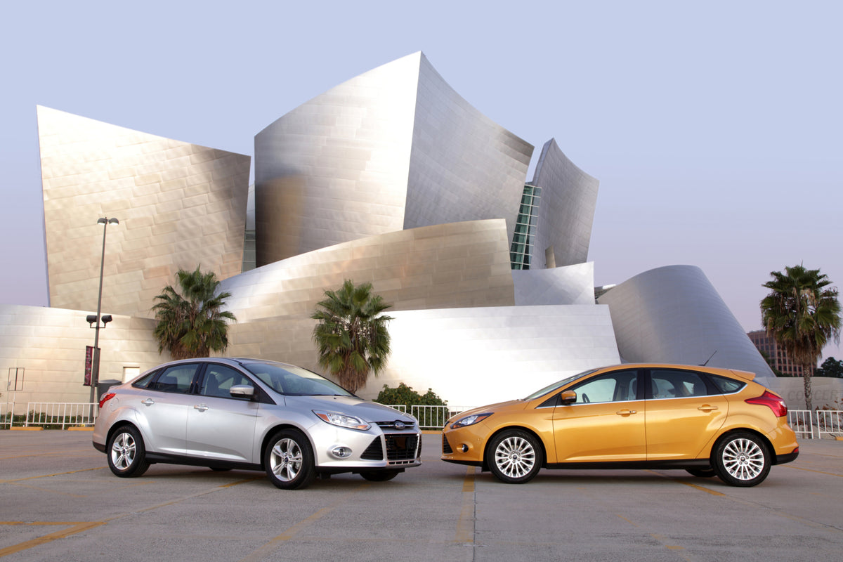 This archival image documents the 2012 Ford Focus hatchback and sedan in front of scenic building MS717 and is preserved in the Ford Heritage Vault as part of Ford Motor Company's historic photographic archive. Free for personal, non-commercial us...