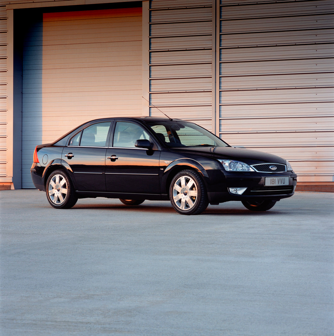 This archival image documents the 2003 Ford Mondeo Mark II side view with scenic building and is preserved in the Ford Heritage Vault as part of Ford Motor Company's historic photographic archive. Free for personal, non-commercial use. Ford Herita...