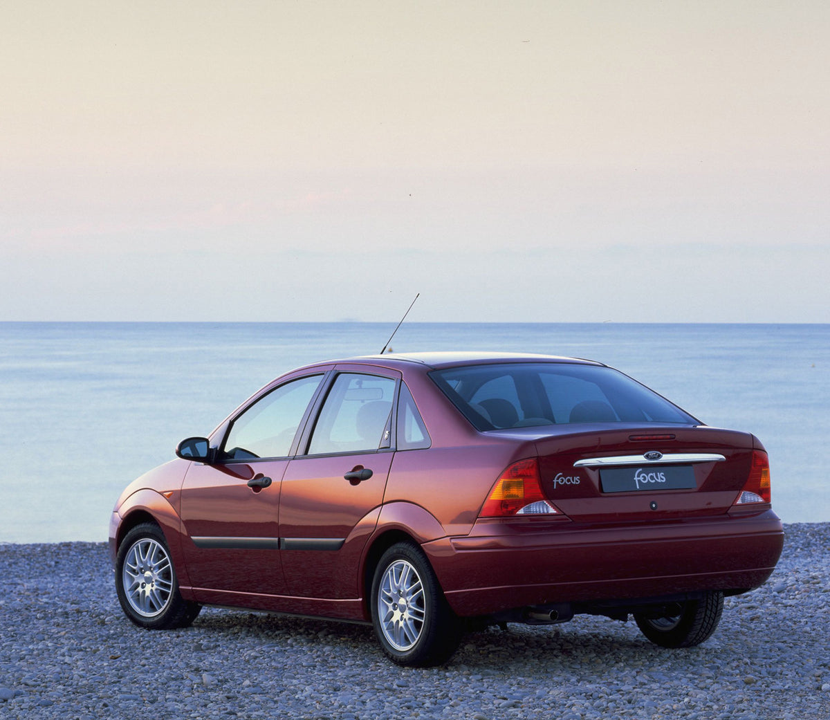 This archival image documents the 1998 Ford Focus rear view on scenic beach and is preserved in the Ford Heritage Vault as part of Ford Motor Company's historic photographic archive. Free for personal, non-commercial use. Ford Heritage Vault refer...