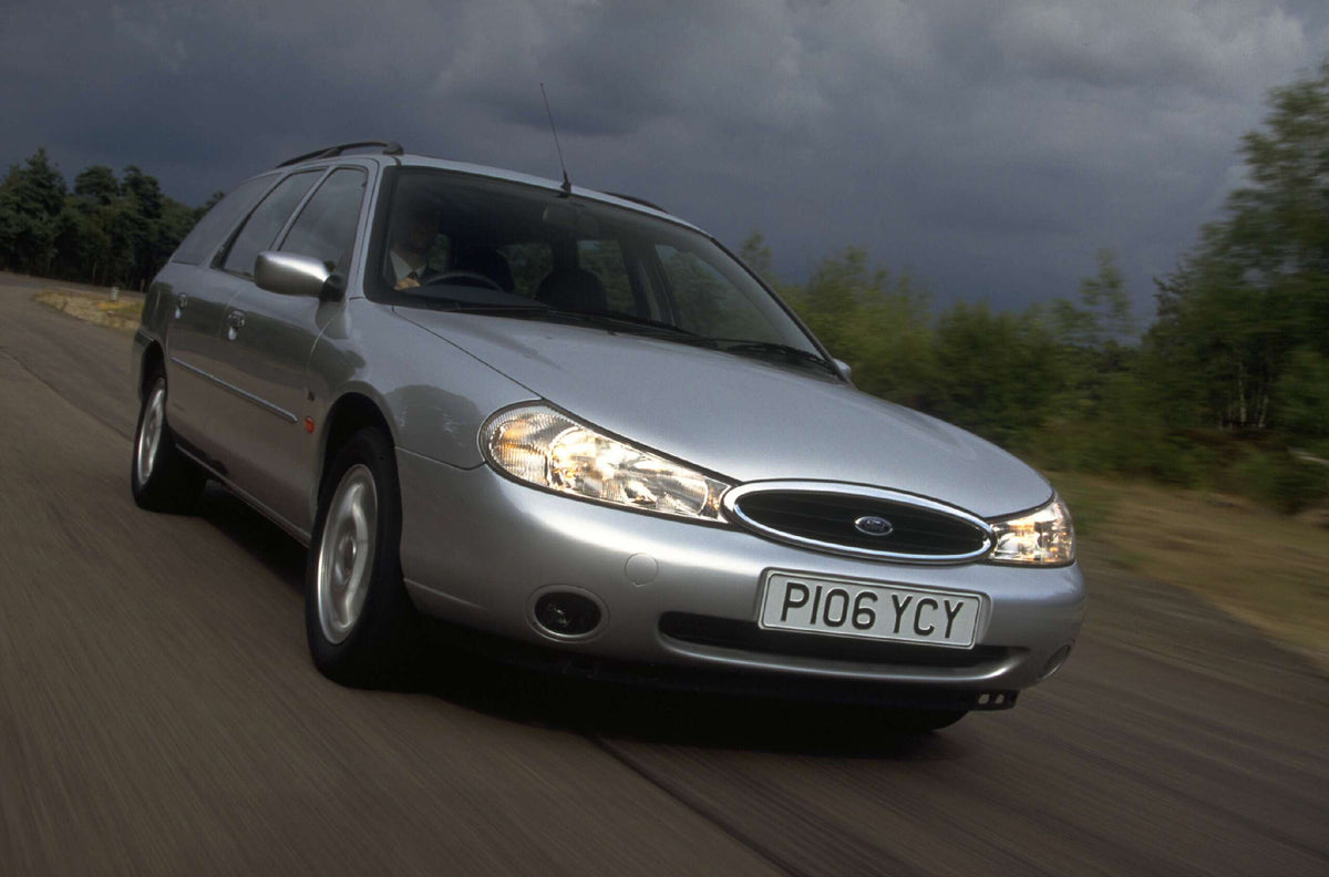 This archival image documents the 1996 Ford Mondeo Mark I Ghia TD action shot on scenic road AR-2002-213709 and is preserved in the Ford Heritage Vault as part of Ford Motor Company's historic photographic archive. Free for personal, non-commercia...