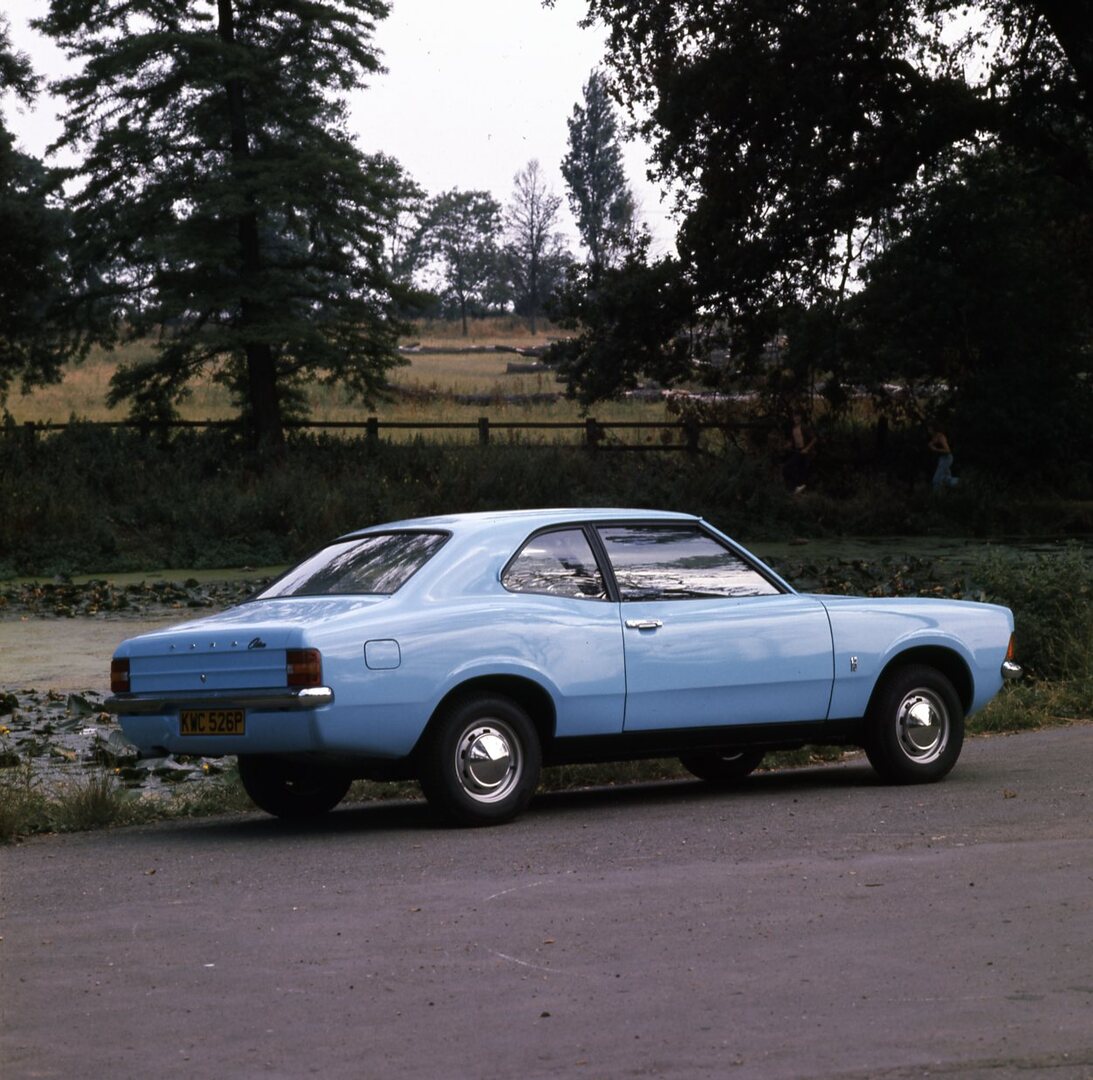 This archival image documents the 1975 Ford Cortina 1.3 Base MK III 2 door rear view on scenic road with marsh and is preserved in the Ford Heritage Vault as part of Ford Motor Company's historic photographic archive. Free for personal, non-commer...