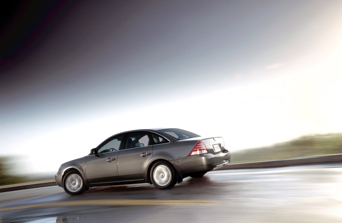 This archival image documents the 2006 Mercury Montego Side View on Road with Blurred Background and is preserved in the Ford Heritage Vault as part of Ford Motor Company's historic photographic archive. Free for personal, non-commercial use. Ford...