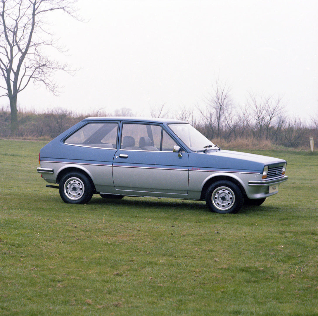 This archival image documents the 1981 Ford Fiesta Mark I Bravo side view in scenic field with trees and is preserved in the Ford Heritage Vault as part of Ford Motor Company's historic photographic archive. Free for personal, non-commercial use. ...