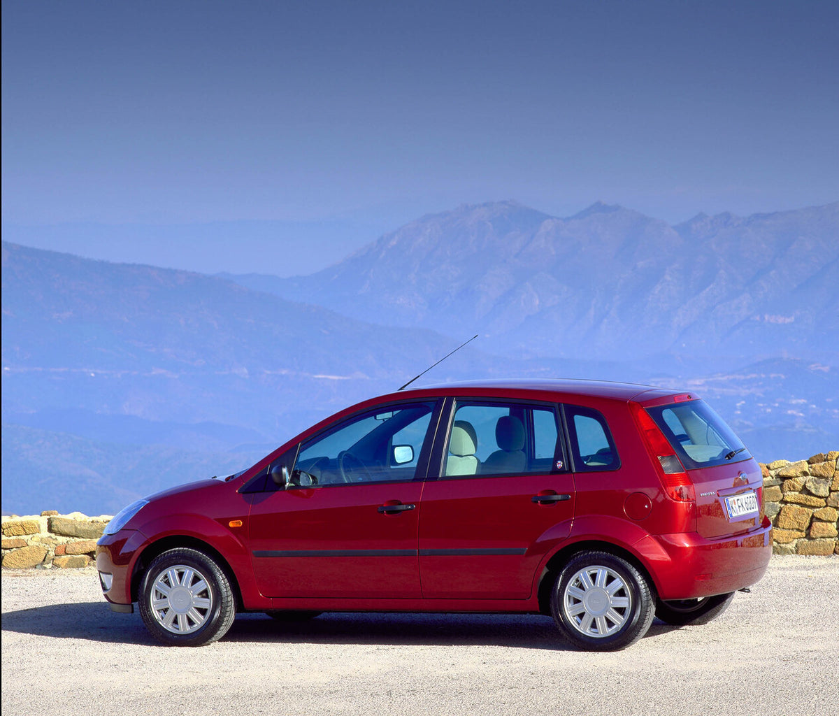 This archival image documents the 2002 Ford Fiesta Mark VI side view on scenic mountain overlook and is preserved in the Ford Heritage Vault as part of Ford Motor Company's historic photographic archive. Free for personal, non-commercial use. Ford...