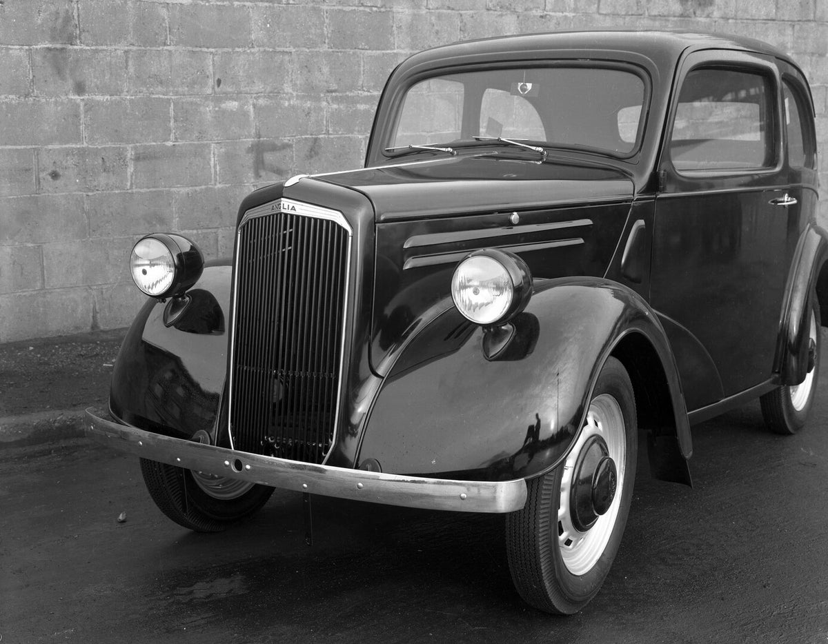 This archival image documents the 1939 Ford Anglia closeup in front of brick wall 10E 21 and is preserved in the Ford Heritage Vault as part of Ford Motor Company's historic photographic archive. Free for personal, non-commercial use. Ford Heritag...