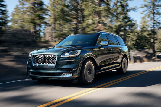 2020 Lincoln Aviator Black Label action shot on scenic road HV 2020-0013