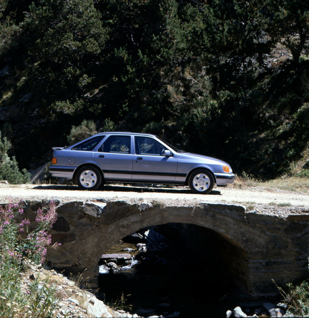 This archival image documents the 1986 Heritage Archive - 1987 1/2 Ford Sierra side view on scenic bridge in Spain and is preserved in the Ford Heritage Vault as part of Ford Motor Company's historic photographic archive. Free for personal, non-co...