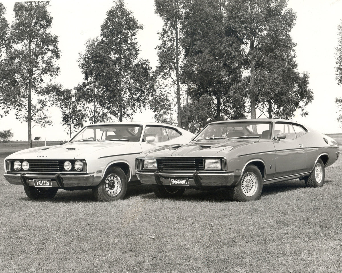 This archival image documents the 1976 Ford XC Falcons in scenic field with trees and is preserved in the Ford Heritage Vault as part of Ford Motor Company's historic photographic archive. Free for personal, non-commercial use. Ford Heritage Vault...