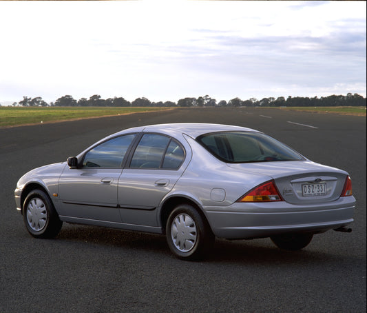 1998 Ford Falcon Forte rear view on scenic road with trees HV 1998-0069