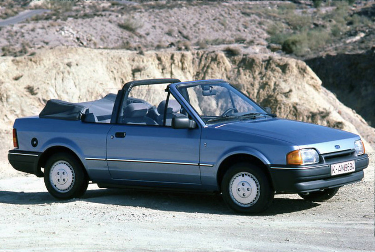 This archival image documents the 1986 Ford Escort Mark IV Cabriolet with scenic rock formation and is preserved in the Ford Heritage Vault as part of Ford Motor Company's historic photographic archive. Free for personal, non-commercial use. Ford ...