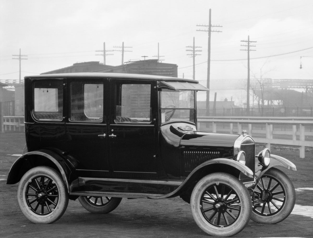 This archival image documents the 1926 Ford Model T Fordor Sedan and is preserved in the Ford Heritage Vault as part of Ford Motor Company's historic photographic archive. Free for personal, non-commercial use. Ford Heritage Vault reference AR-200...