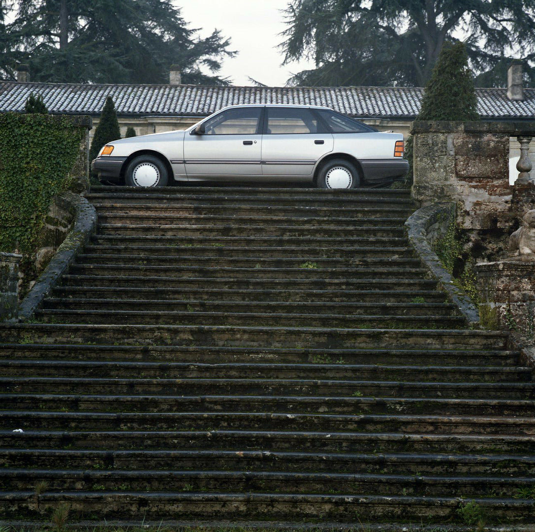 This archival image documents the 1984 Ford Scorpio Mark I LHD side view on scenic staircase in Bordeaux and is preserved in the Ford Heritage Vault as part of Ford Motor Company's historic photographic archive. Free for personal, non-commercial u...
