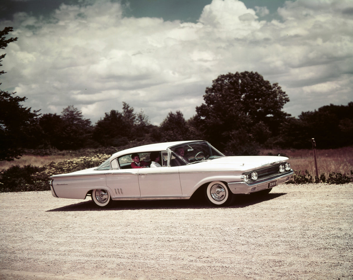 This archival image documents the 1960 Mercury Montclair four-door hardtop on Gravel Road with People and is preserved in the Ford Heritage Vault as part of Ford Motor Company's historic photographic archive. Free for personal, non-commercial use....