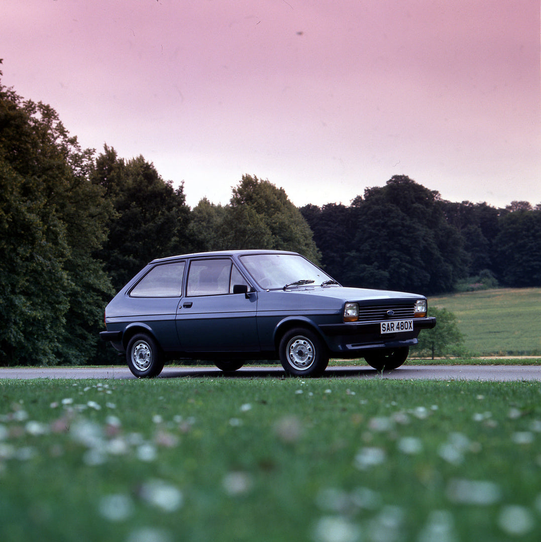 This archival image documents the 1981 Ford Fiesta Mark I L on scenic road with trees and is preserved in the Ford Heritage Vault as part of Ford Motor Company's historic photographic archive. Free for personal, non-commercial use. Ford Heritage V...