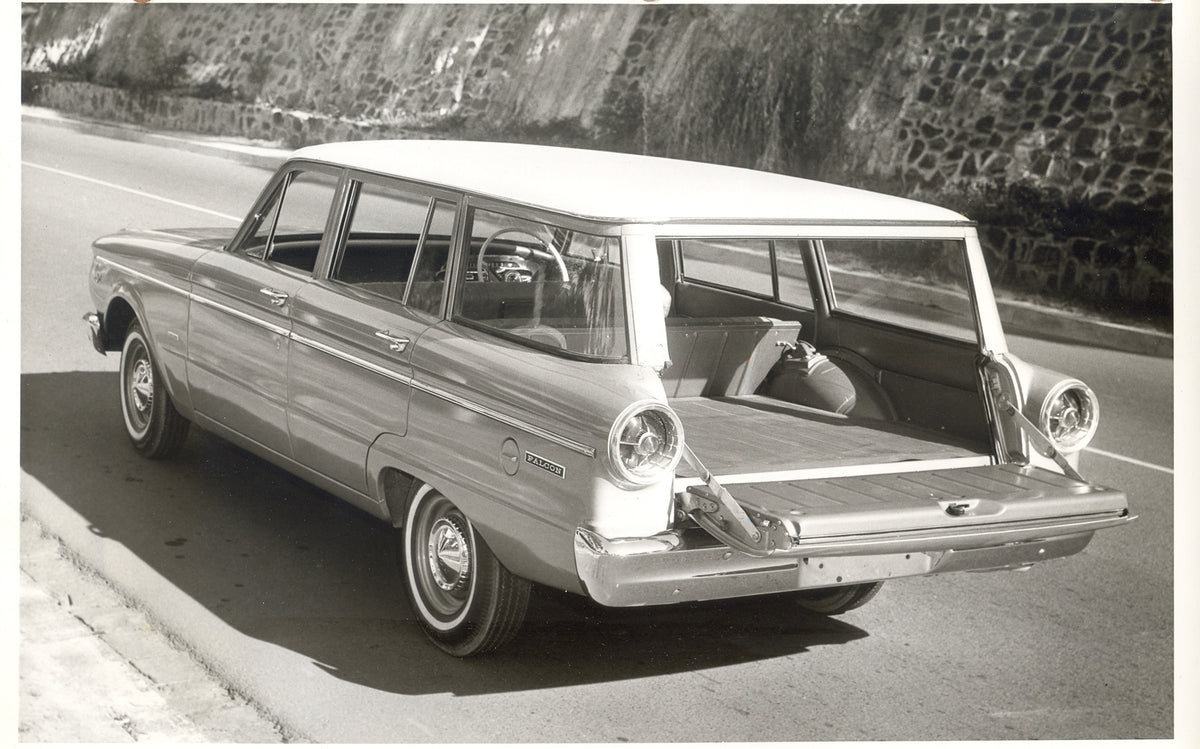 This archival image documents the 1965 Ford XP Falcon Station Wagon rear view with open trunk on road and is preserved in the Ford Heritage Vault as part of Ford Motor Company's historic photographic archive. Free for personal, non-commercial use....