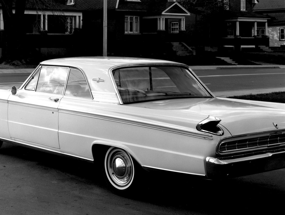 This archival image documents the 1963 Mercury Meteor Coupe rear view closeup on street with houses AR-2007-5 and is preserved in the Ford Heritage Vault as part of Ford Motor Company's historic photographic archive. Free for personal, non-commerc...