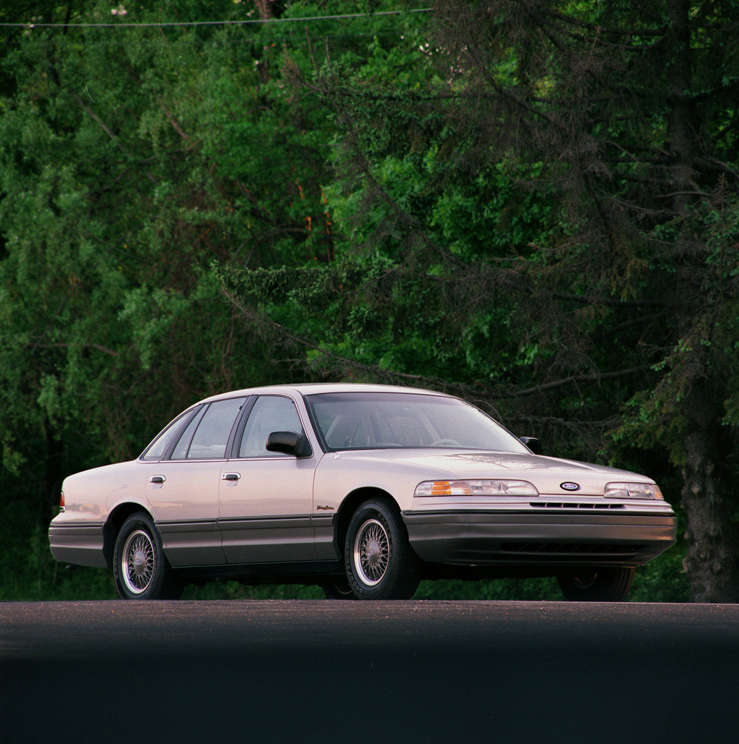 This archival image documents the 1992 Ford Crown Victoria Touring Sedan and is preserved in the Ford Heritage Vault as part of Ford Motor Company's historic photographic archive. Free for personal, non-commercial use. Ford Heritage Vault referenc...