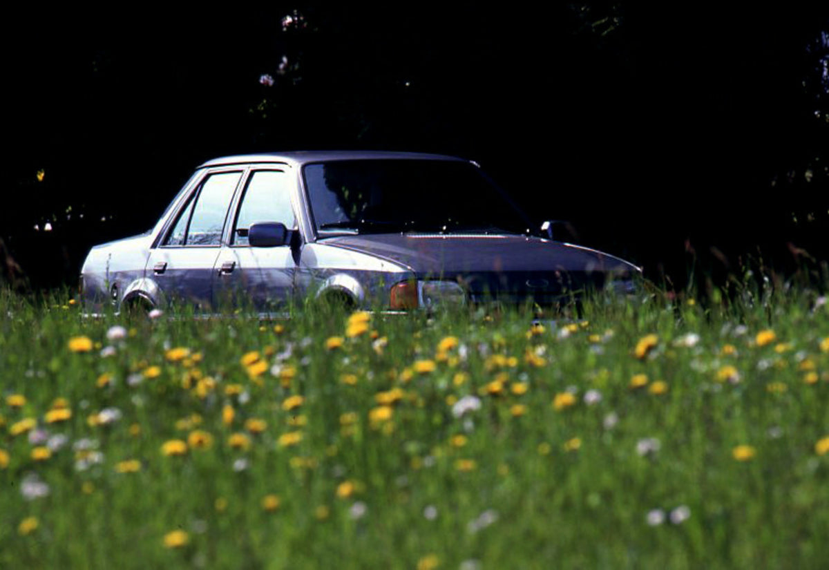 This archival image documents the 1989 Ford Orion Mark II LHD low view with scenic flowers and is preserved in the Ford Heritage Vault as part of Ford Motor Company's historic photographic archive. Free for personal, non-commercial use. Ford Herit...