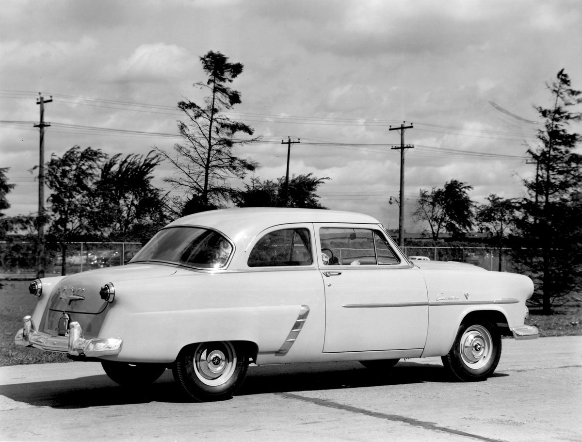 This archival image documents the 1952 Meteor Customline Coupe rear view on scenic road AR-2007-5 and is preserved in the Ford Heritage Vault as part of Ford Motor Company's historic photographic archive. Free for personal, non-commercial use. For...