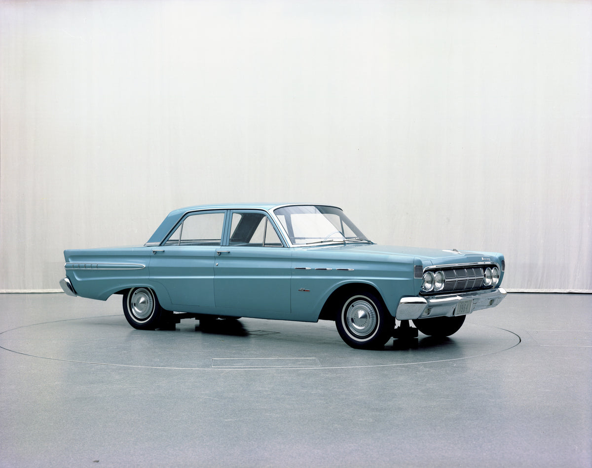 This archival image documents the 1964 Mercury Comet 202 four-door and is preserved in the Ford Heritage Vault as part of Ford Motor Company's historic photographic archive. Free for personal, non-commercial use. Ford Heritage Vault reference AR-2...