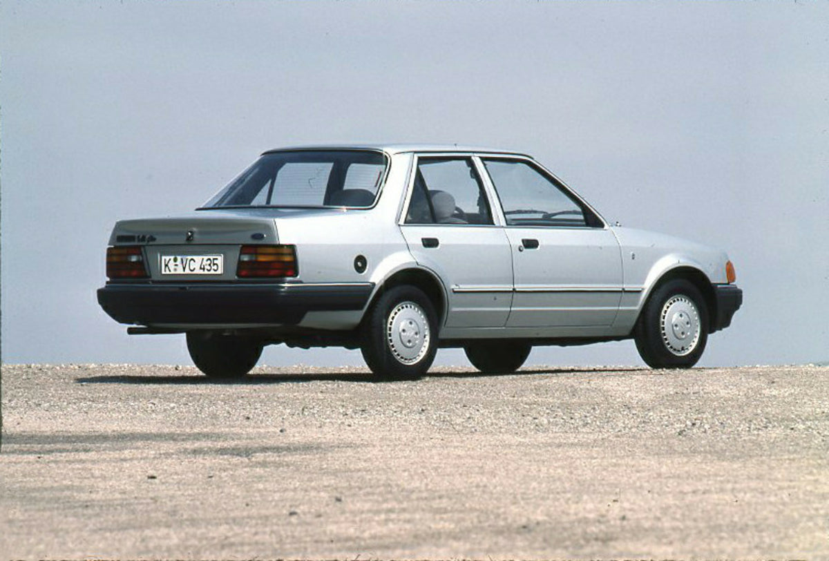 This archival image documents the 1986 Ford Orion Mark II 1.4 Ghia rear view with scenic blue sky and is preserved in the Ford Heritage Vault as part of Ford Motor Company's historic photographic archive. Free for personal, non-commercial use. For...