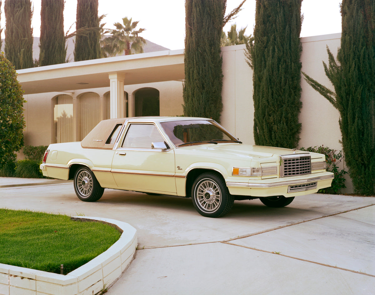 This archival image documents the 1980 Ford Thunderbird in driveway and is preserved in the Ford Heritage Vault as part of Ford Motor Company's historic photographic archive. Free for personal, non-commercial use. Ford Heritage Vault reference AR-...