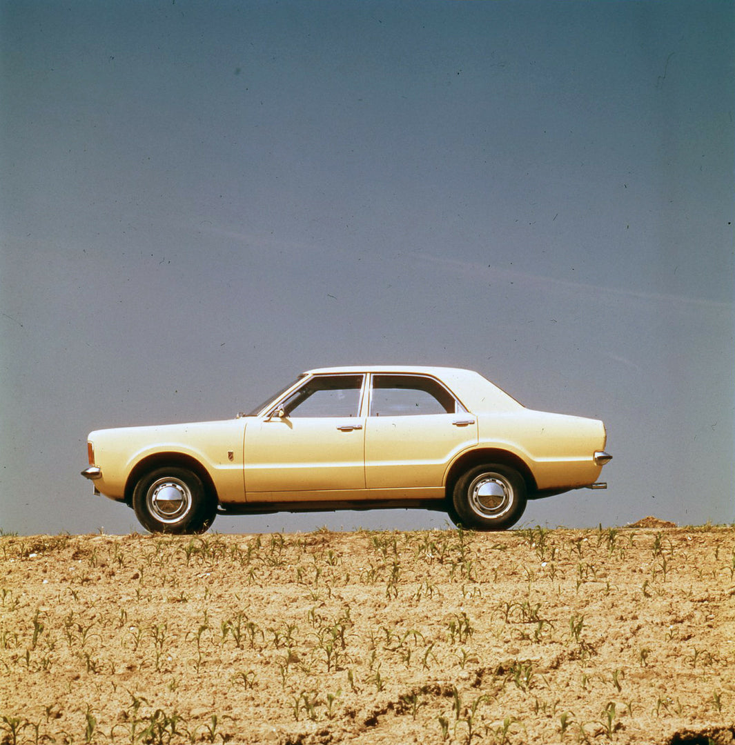 This archival image documents the 1974 Ford Taunus side view on scenic hill and is preserved in the Ford Heritage Vault as part of Ford Motor Company's historic photographic archive. Free for personal, non-commercial use. Ford Heritage Vault refer...