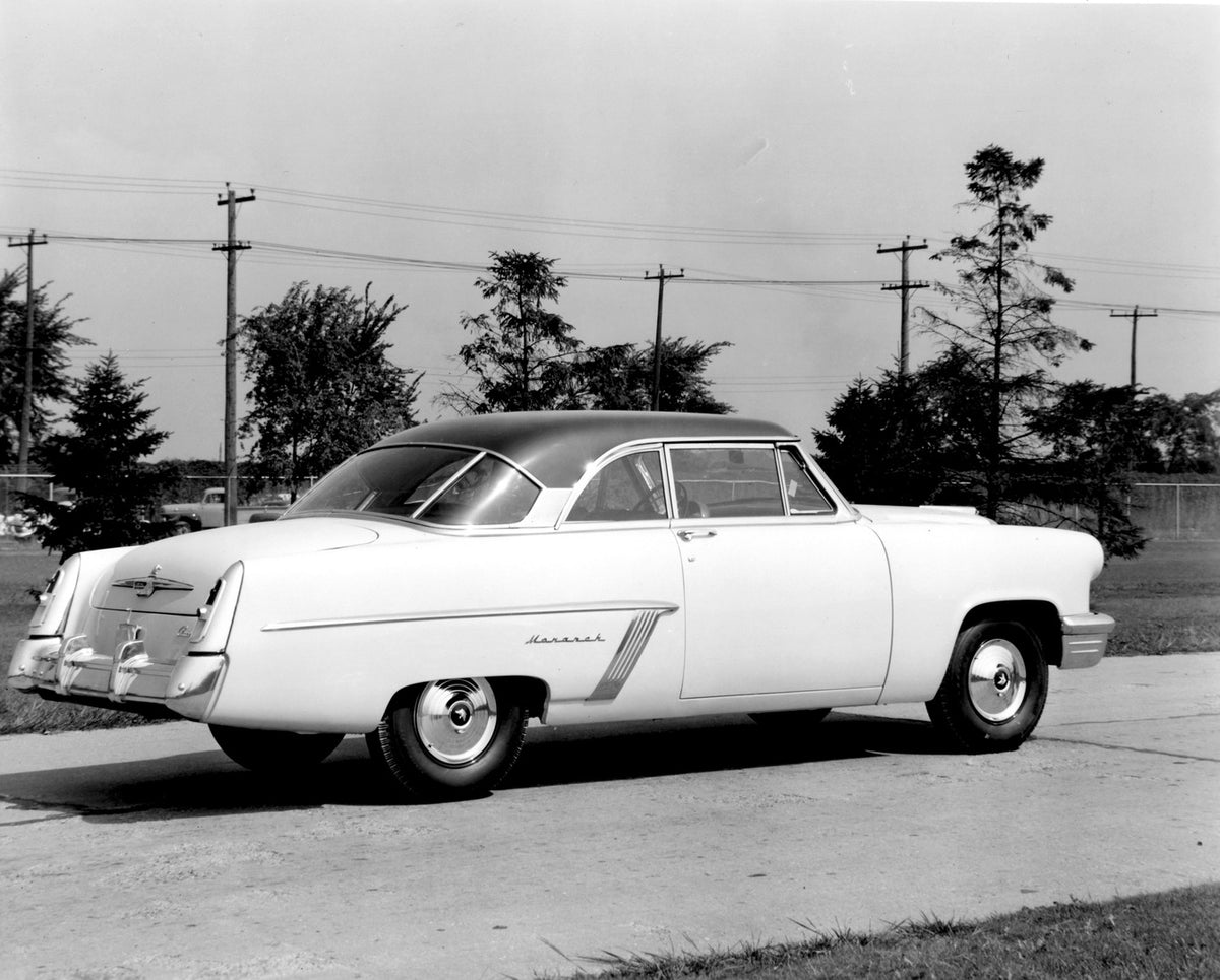 This archival image documents the 1952 Monarch Coupe rear view on scenic road AR-2007-5 and is preserved in the Ford Heritage Vault as part of Ford Motor Company's historic photographic archive. Free for personal, non-commercial use. Ford Heritage...