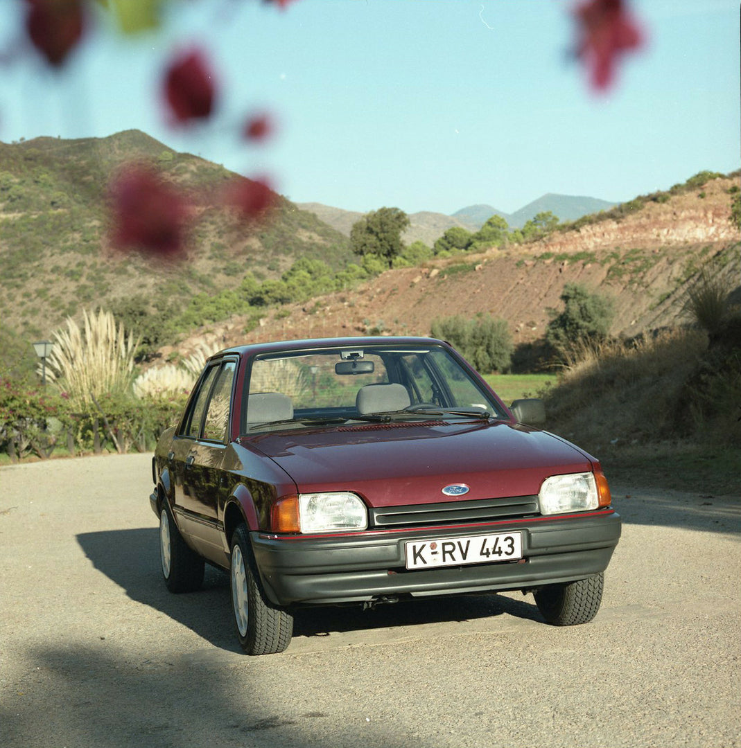 This archival image documents the 1985 Ford Orion Mark I 1.6 LHD front view on scenic road and is preserved in the Ford Heritage Vault as part of Ford Motor Company's historic photographic archive. Free for personal, non-commercial use. Ford Herit...