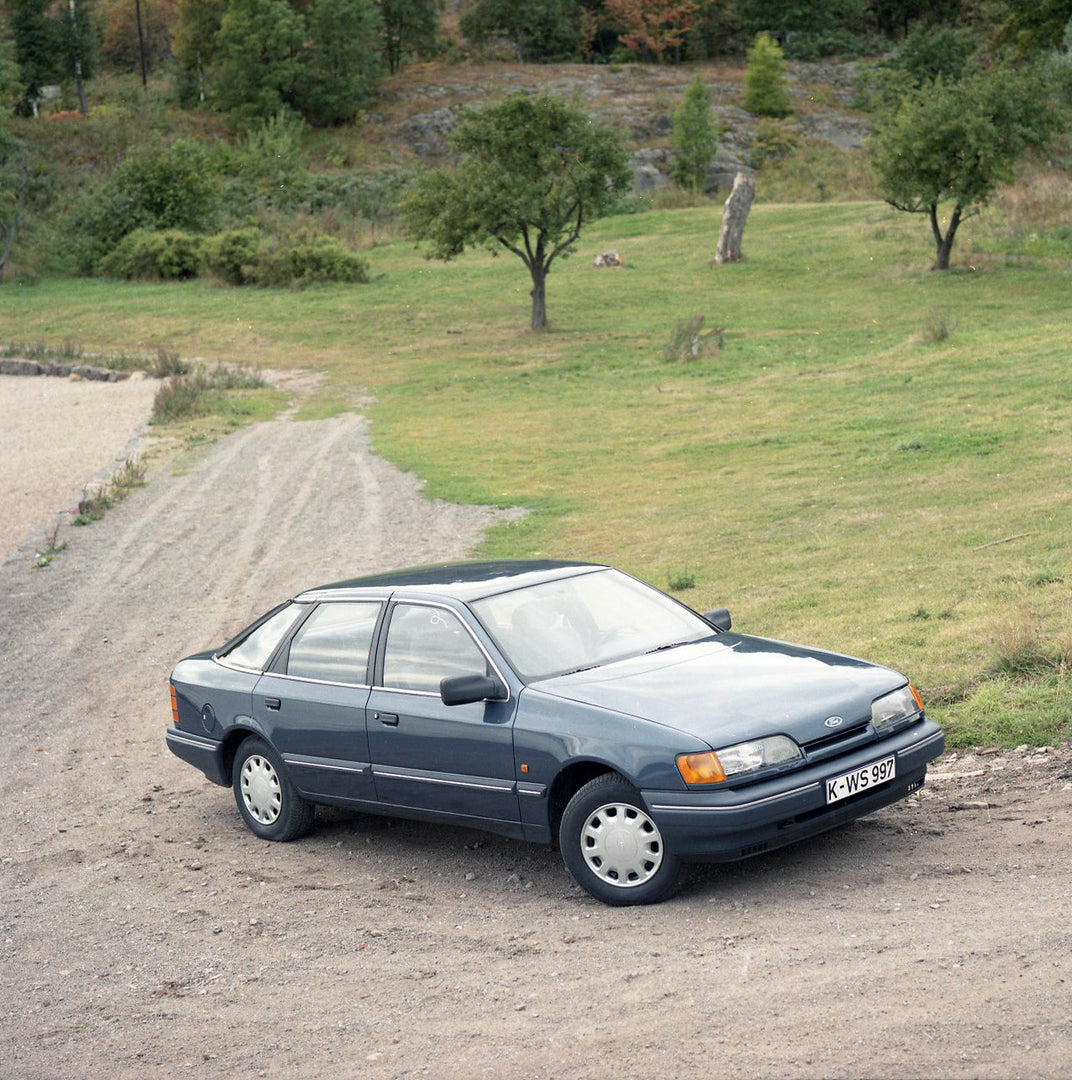 This archival image documents the 1984 Ford Scorpio Mark I GL LHD on scenic dirt road with trees in Norway and is preserved in the Ford Heritage Vault as part of Ford Motor Company's historic photographic archive. Free for personal, non-commercial...