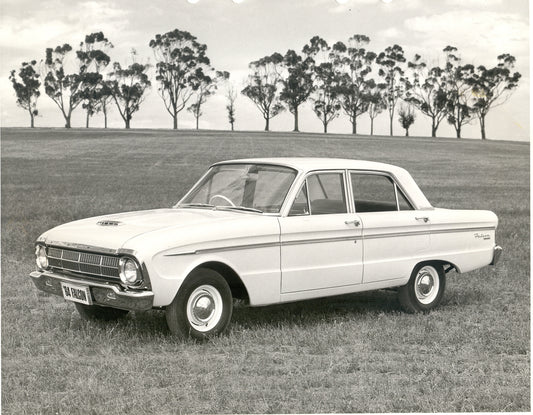1964 Ford XM Falcon in scenic field with trees HV 1964-0109
