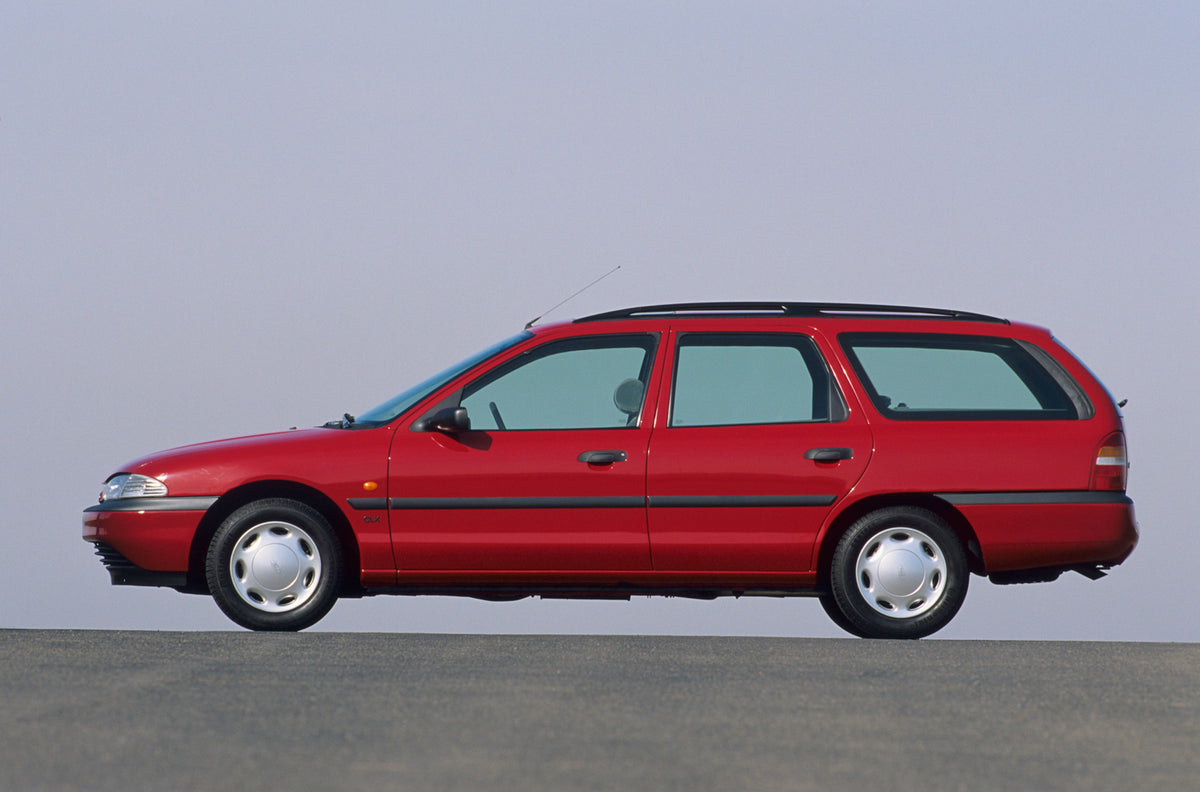 This archival image documents the 1992 Ford Mondeo Mark I side view with scenic blue sky and is preserved in the Ford Heritage Vault as part of Ford Motor Company's historic photographic archive. Free for personal, non-commercial use. Ford Heritag...