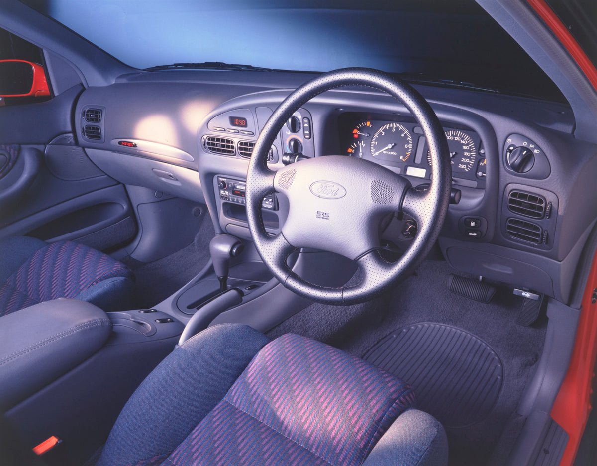 This archival image documents the 1994 Ford ED Falcon XR6 Sedan Steering Wheel Interior View FAP-2011-3 and is preserved in the Ford Heritage Vault as part of Ford Motor Company's historic photographic archive. Free for personal, non-commercial us...