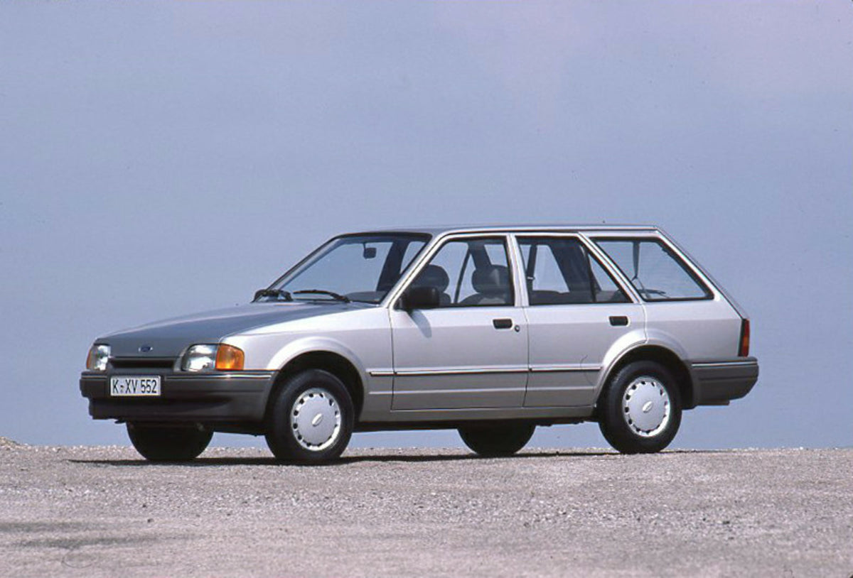 This archival image documents the 1986 Ford Escort Mark IV with scenic blue sky and is preserved in the Ford Heritage Vault as part of Ford Motor Company's historic photographic archive. Free for personal, non-commercial use. Ford Heritage Vault r...