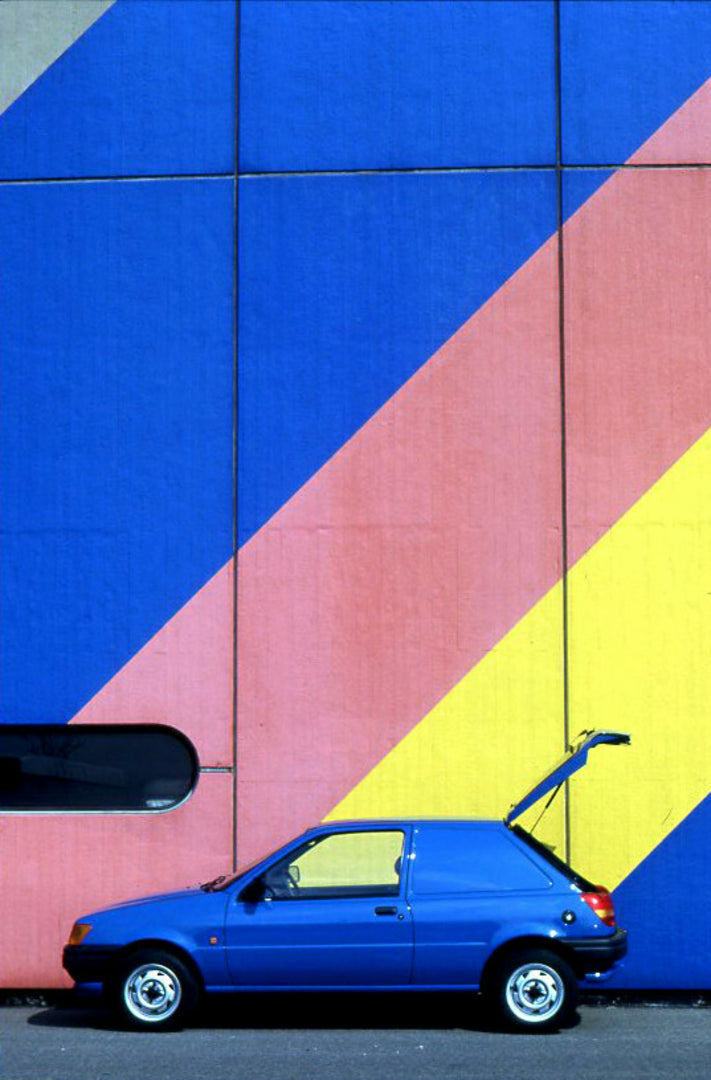 This archival image documents the 1989 Ford Fiesta Mark III Van side view with sceni wall and is preserved in the Ford Heritage Vault as part of Ford Motor Company's historic photographic archive. Free for personal, non-commercial use. Ford Herita...