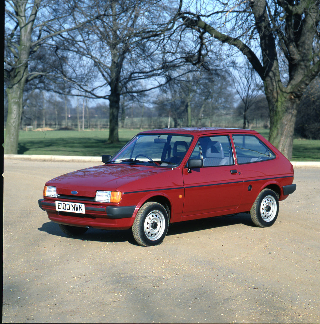 This archival image documents the 1987 Ford Fiesta Mark II Popular Plus in scenic parking lot and is preserved in the Ford Heritage Vault as part of Ford Motor Company's historic photographic archive. Free for personal, non-commercial use. Ford He...