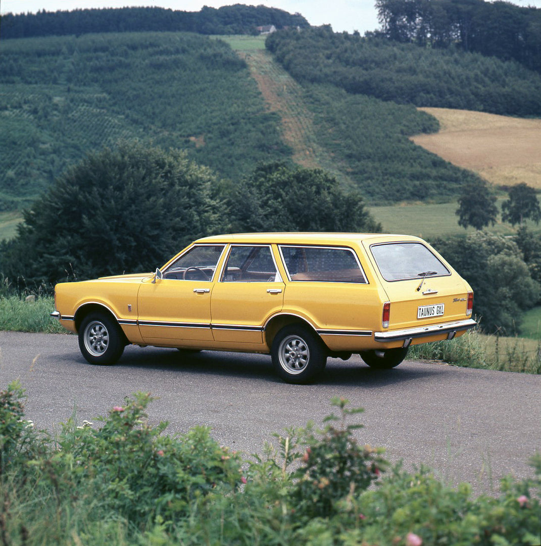 This archival image documents the 1974 Ford Taunus Estate GXL rear view on scenic road and is preserved in the Ford Heritage Vault as part of Ford Motor Company's historic photographic archive. Free for personal, non-commercial use. Ford Heritage ...