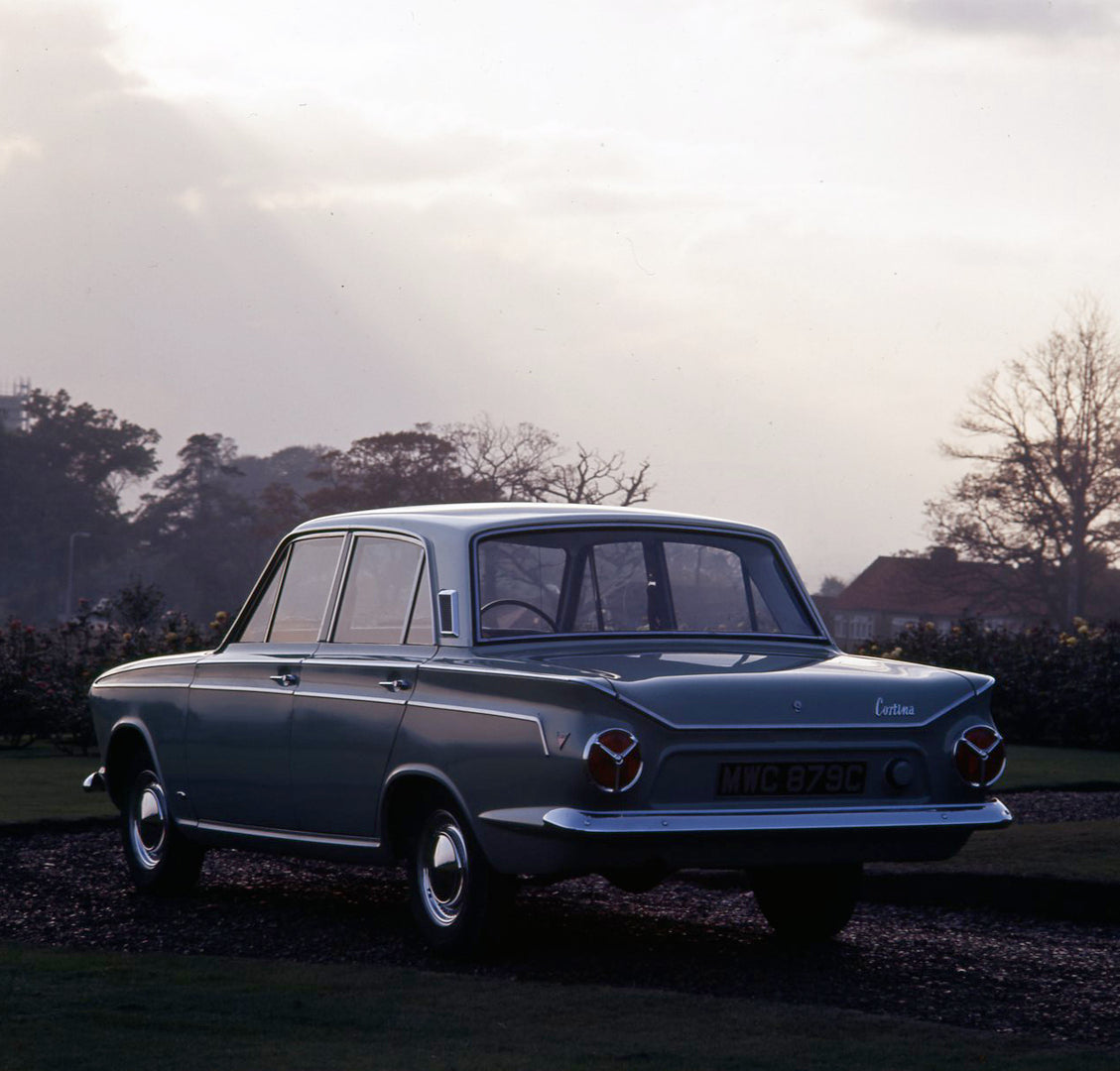 This archival image documents the 1964 Ford Cortina Super MK I rear view on scenic road and is preserved in the Ford Heritage Vault as part of Ford Motor Company's historic photographic archive. Free for personal, non-commercial use. Ford Heritage...