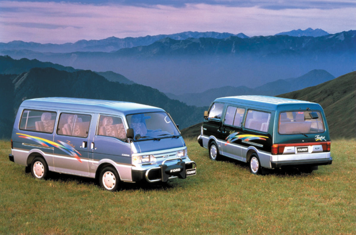 This archival image documents the 1999 Ford Pronto vans on scenic mountain overlook and is preserved in the Ford Heritage Vault as part of Ford Motor Company's historic photographic archive. Free for personal, non-commercial use. Ford Heritage Vau...