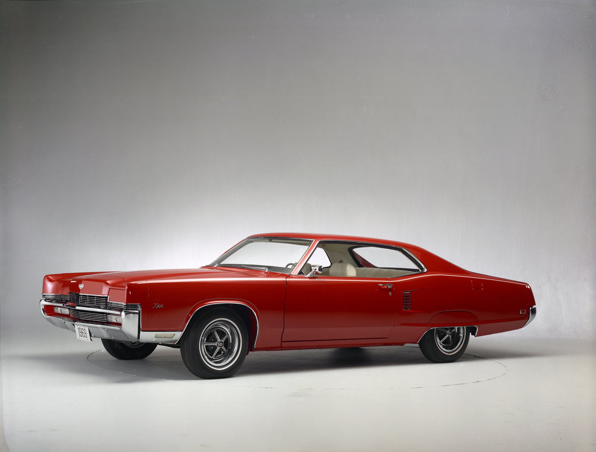 This archival image documents the 1969 Mercury Marauder X-100 Two-Door Hardtop and is preserved in the Ford Heritage Vault as part of Ford Motor Company's historic photographic archive. Free for personal, non-commercial use. Ford Heritage Vault re...
