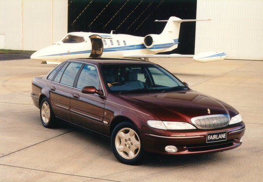 1998 Ford NL Fairlane Ghia Concorde at hangar with plane HV 1998-0056