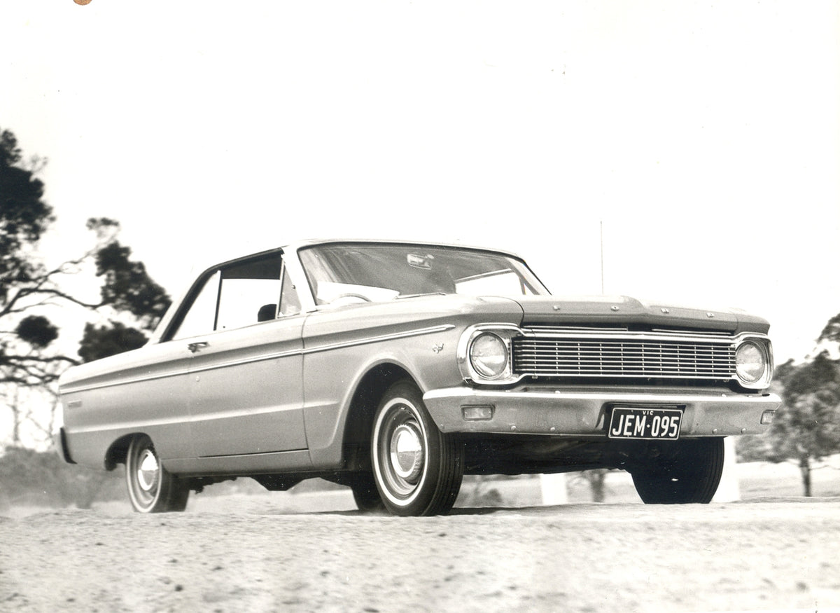 This archival image documents the 1965 Ford XP Falcon 2 Door Hardtop low view action shot with scenic trees and is preserved in the Ford Heritage Vault as part of Ford Motor Company's historic photographic archive. Free for personal, non-commercia...