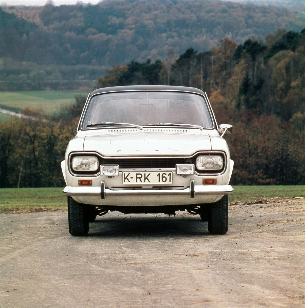 This archival image documents the 1974 Ford Escort Mark I GXL front view on scenic road with trees and is preserved in the Ford Heritage Vault as part of Ford Motor Company's historic photographic archive. Free for personal, non-commercial use. Fo...