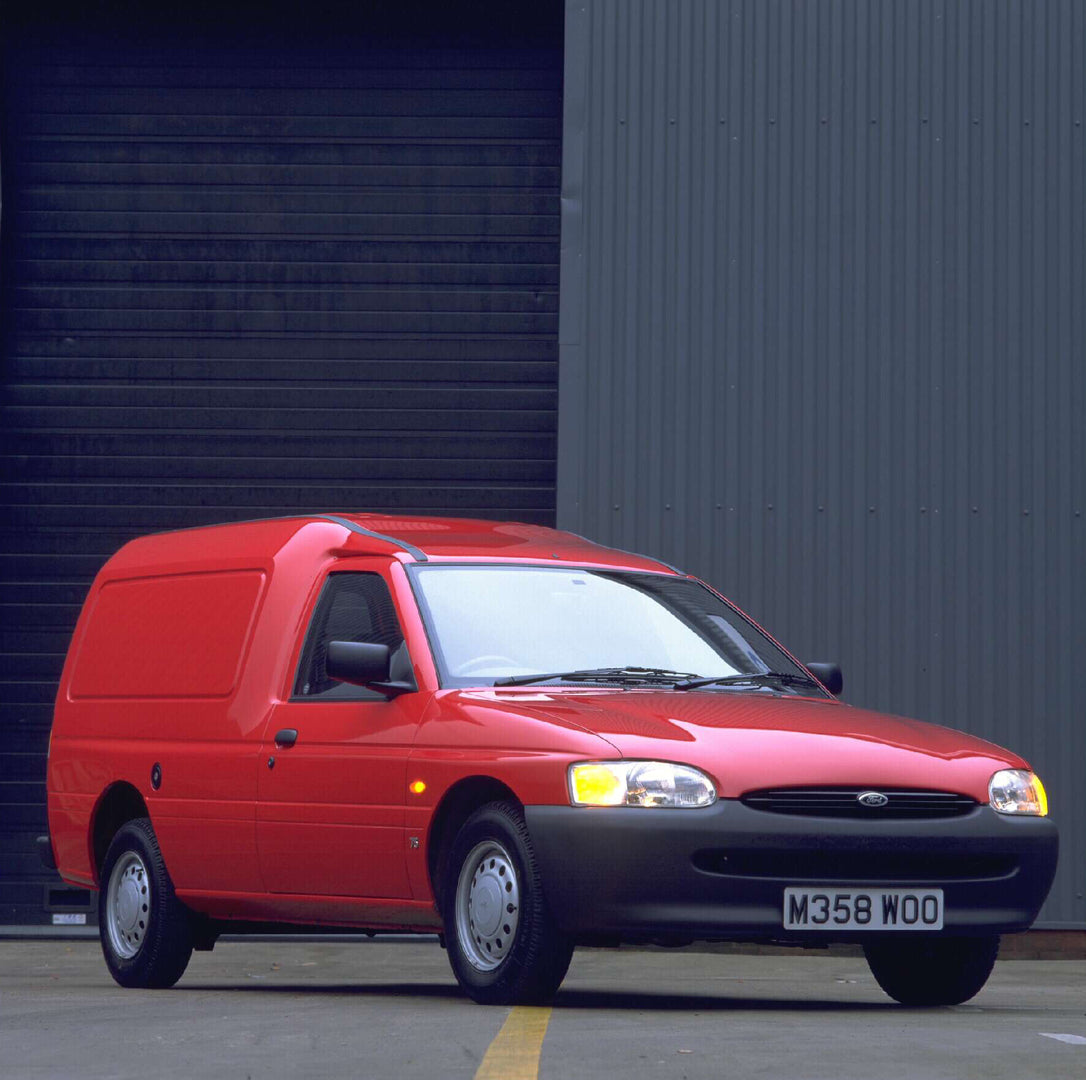This archival image documents the 1995 Ford Escort Mark VI Van in front of garage AR-2002-213709 and is preserved in the Ford Heritage Vault as part of Ford Motor Company's historic photographic archive. Free for personal, non-commercial use. Ford...